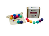 Connetix Replacement Ball Pack - Pastel on display with the 16 pastel balls and white bag in front of connetix box