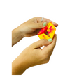 a hand holding a red and yellow Flexygon Fidget Toy