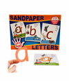 Hand holding a letter a sandpaper letter in front of Smart Kids Let&#39;s Feel Sandpaper Letters